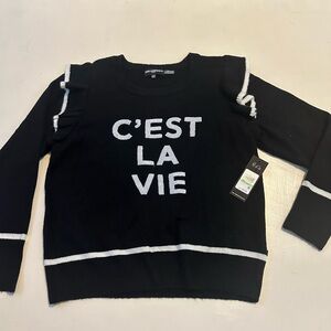 Women’s black sweater with ruffle sleeve. New with tags, glitter letter front.